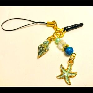 Gold tone Beach themed phone charm w strap & plug